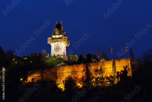 The Schlossberg or Castle Hill with the tower Uhrturm at night, Graz, Austria