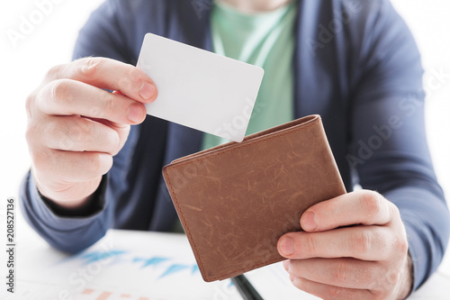 Man in suit with wallet and credit card