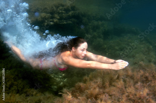 woman dives into the water  Black sea  Crimea  Ukraine  Europe