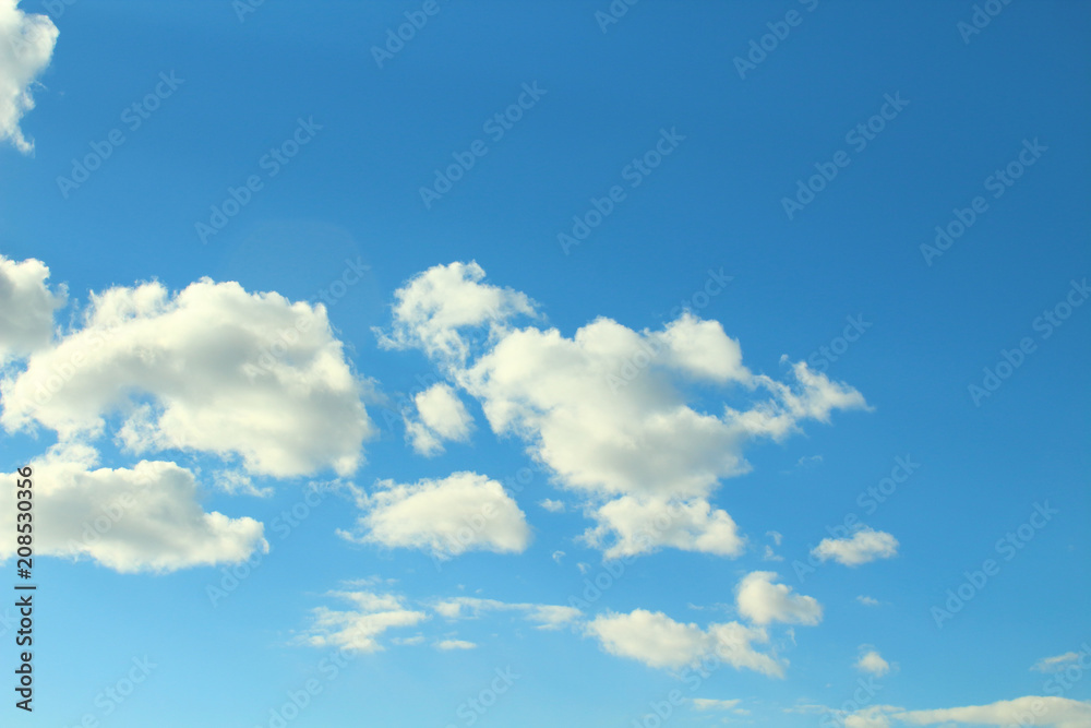 Beautiful natural blue sky and white fluffy clouds. Background. Landscape. Beautiful natural blue sky and white fluffy clouds. Background. Landscape.