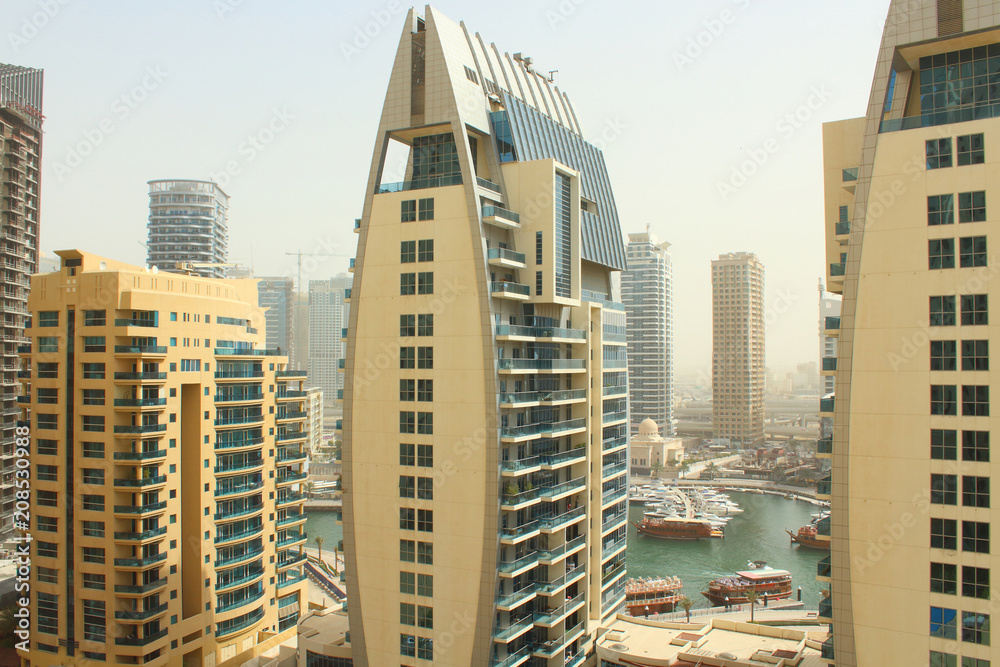Fototapeta premium Beautiful cityscape. Skyscrapers in Dubai. City of the future. Background. United Arab Emirates. Dubai, March, 2018.