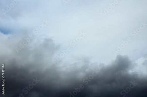 The blue sky and dark storm clouds. Background. Landscape.