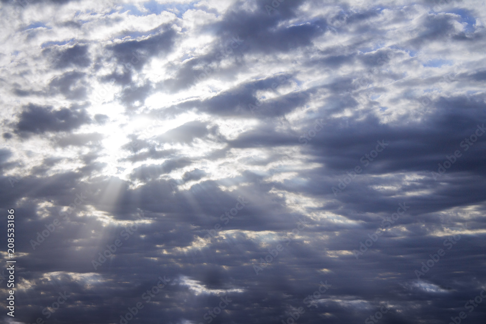 Photo of blue sky with clouds on sunny day, sky with clouds and sun rays Photo of blue sky with clouds on sunny day, sky with clouds and sun rays