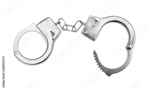 Opened handcuffs  on white background. Top view. photo