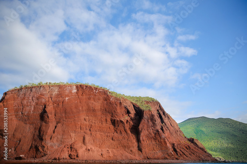 Red rocky coastline of Rabida Island in the Galapagos