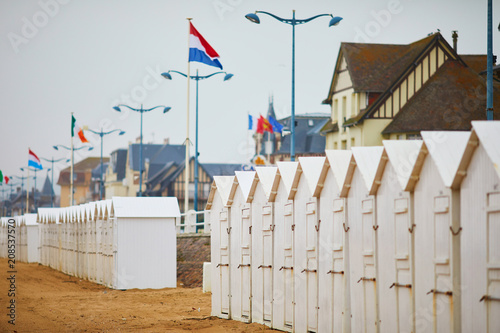 Cabanas on beach of Villers-sur-Mer in Lower Normandy, France photo