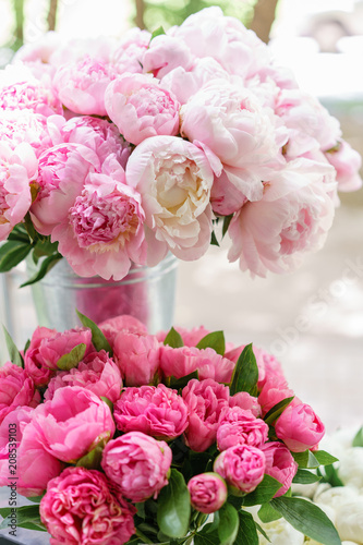 Fototapeta Naklejka Na Ścianę i Meble -  Lovely flowers in glass vase. Beautiful bouquet of pink peonies . Floral composition, scene, daylight. Wallpaper