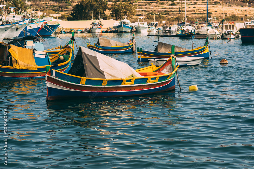 Classic maltese boats,  view to bay of Marsaxlokk