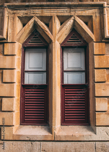 Maltese old blue window with curtains, Malta