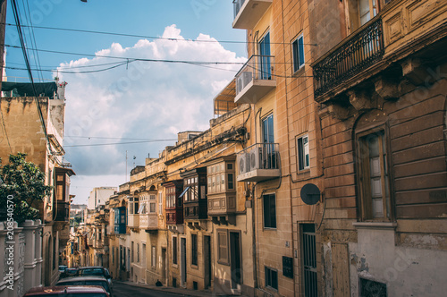 Street view in Sliema, traditional balconies, Malta
