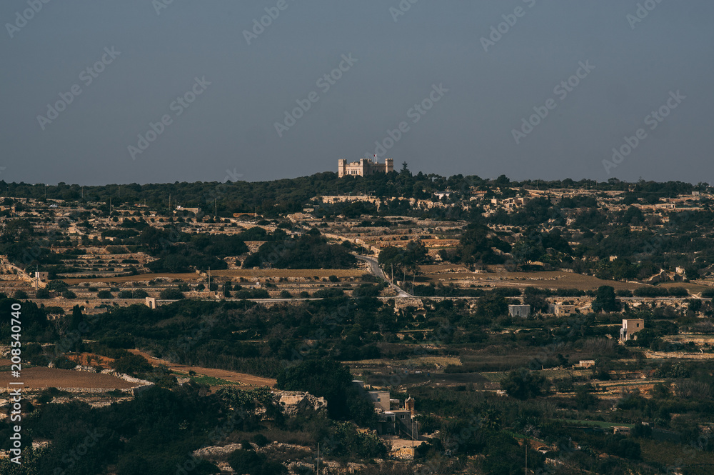 View to Tal-Virtu Palazzo and agriculture fields in countryside of Malta