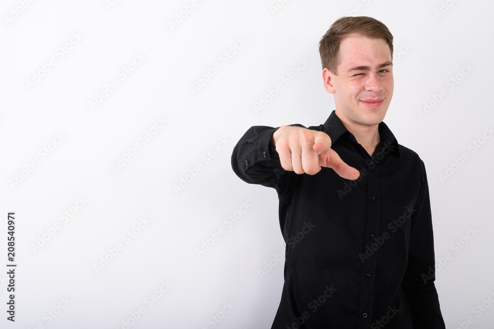 Young handsome businessman against white background Young handsome businessman against white background