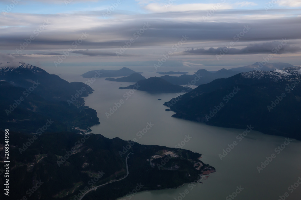 Aerial view of Howe Sound during a cloudy evening. Taken near Squamish, North of Vancouver, British Columbia, Canada.