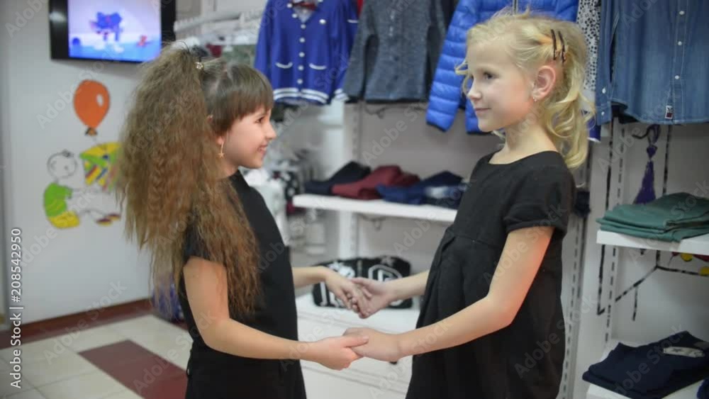 Two little girls kissing each other at the mall Stock-Video | Adobe Stock