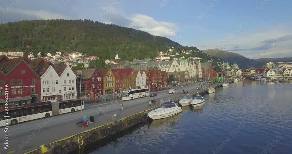 Aerial view across VÎgen harbour to Mount Ulriken above historic medieval wooden Hanseatic buildings in the old harbour district of Bryggen, Bergen, Hordaland, Norway Aerial view across VÎgen harbour to Mount Ulriken above historic medieval wooden Hanseatic buildings in the old harbour district of Bryggen, Bergen, Hordaland, Norway
