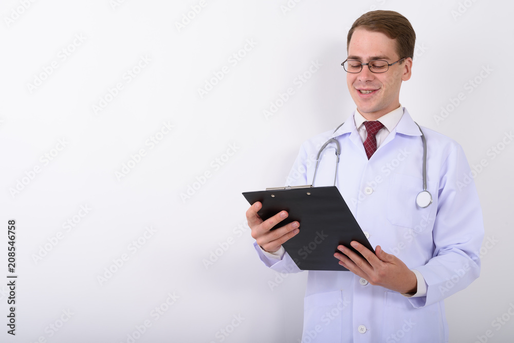 Young handsome man doctor wearing eyeglasses against white backg Young handsome man doctor wearing eyeglasses against white backg