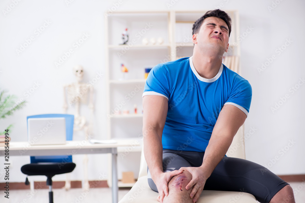 Patient visiting doctor after sustaining sports injury