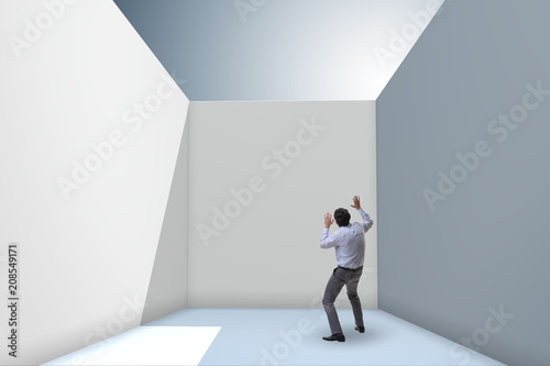 Businessman trying to escape from difficult situation