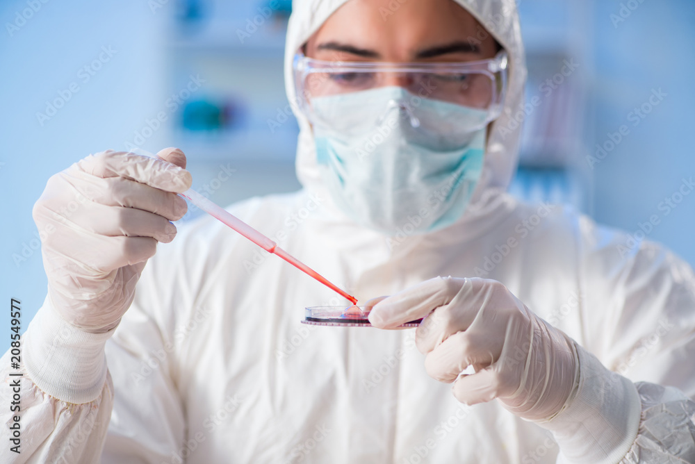 Lab assistant testing blood samples in hospital Lab assistant testing blood samples in hospital