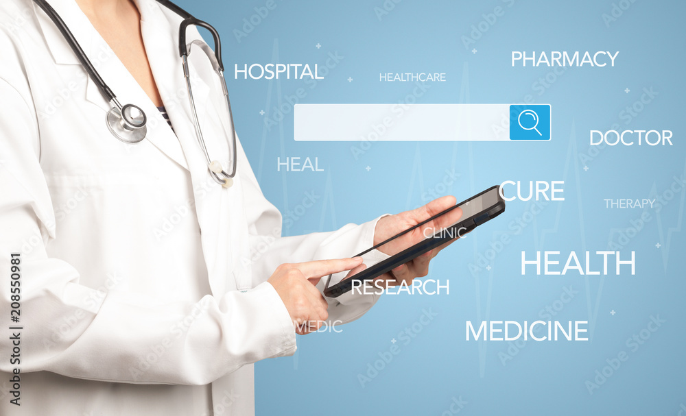 Female doctor holding tablet with blue background and search bar with hovering medical words Female doctor holding tablet with blue background and search bar with hovering medical words