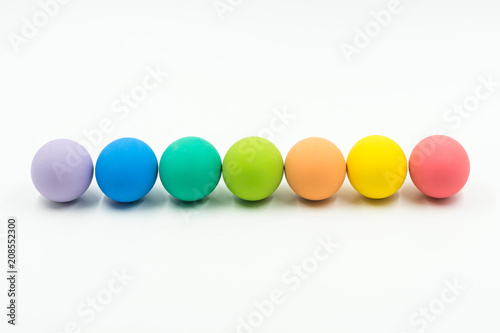 row of colourful of easter eggs on white background