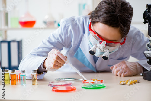 Lab assistant in drug synthesis concept