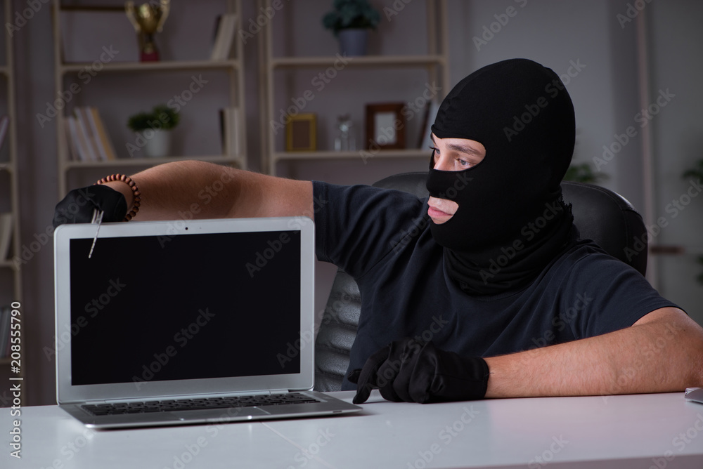 Hacker hacking computer late at night Hacker hacking computer late at night