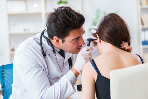 Photography Doctor checking patients ear during medical examination