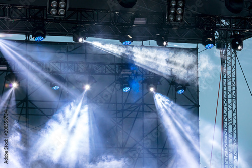 outdoor stage equipment. stage lights and searchlights during street concert 