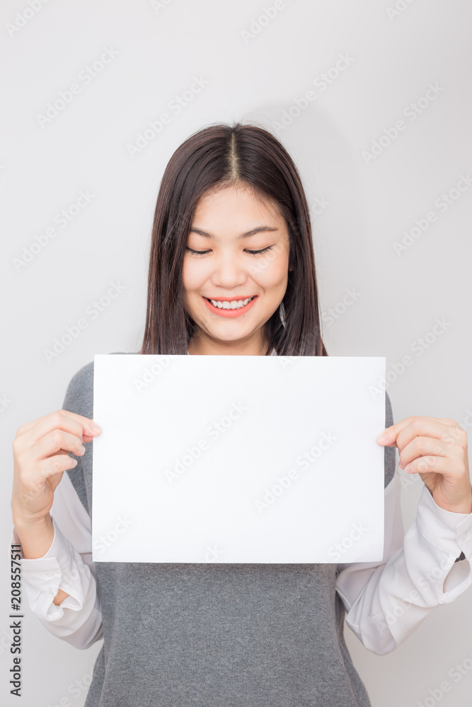 Beautiful young asian women holding blank white paper banner Beautiful young asian women holding blank white paper banner