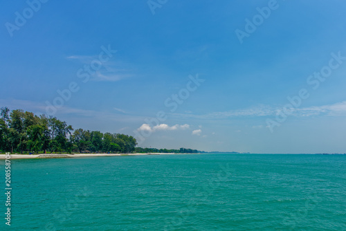 Singapore East Coast facing east with turquoise water and beach in the background