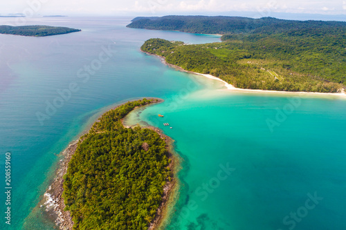 Rocky island sea beach with green tree aerial view © themorningglory