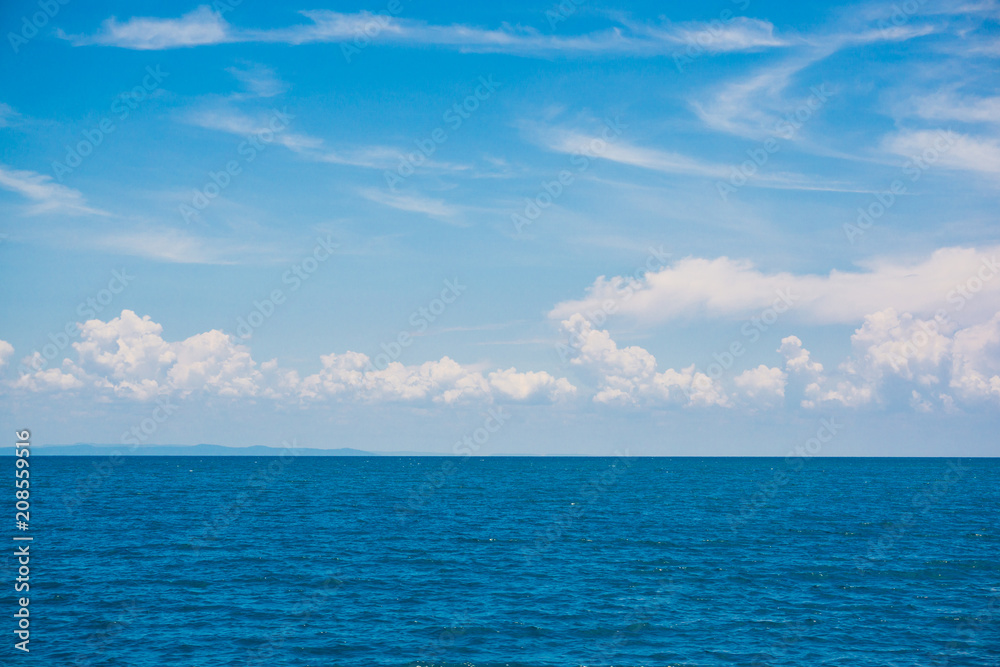 Idyllic perfect blue sky seascape with cloud