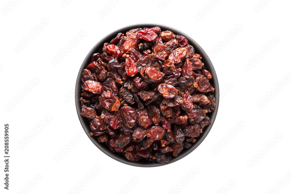 dry red barberry in clay bowl isolated on white background. Seasoning or spice top view dry red barberry in clay bowl isolated on white background. Seasoning or spice top view