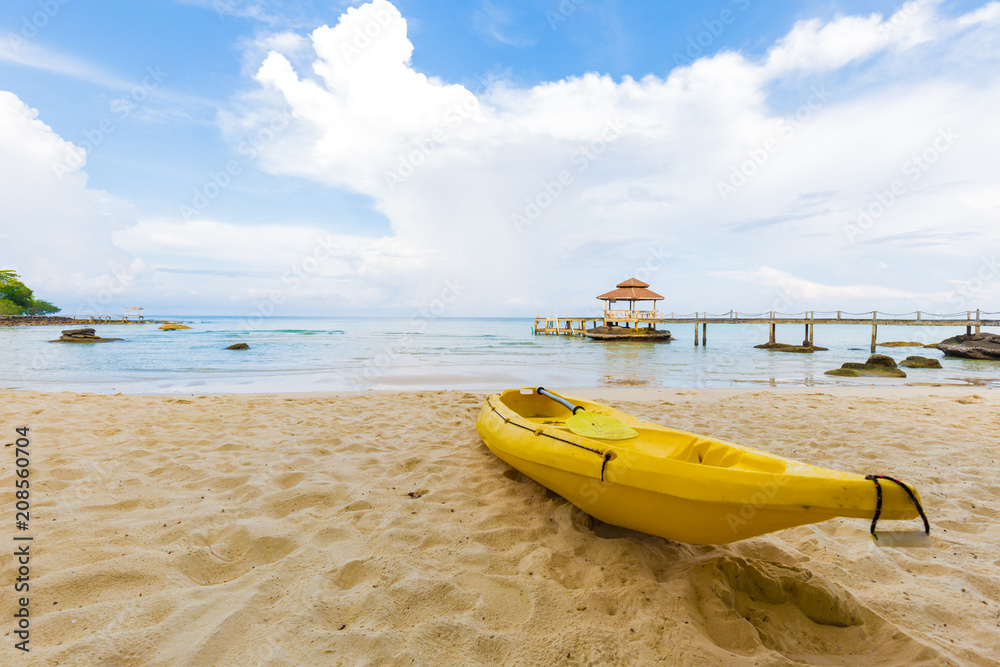 Nice tropical white sand beach with kayak boat in island Nice tropical white sand beach with kayak boat in island