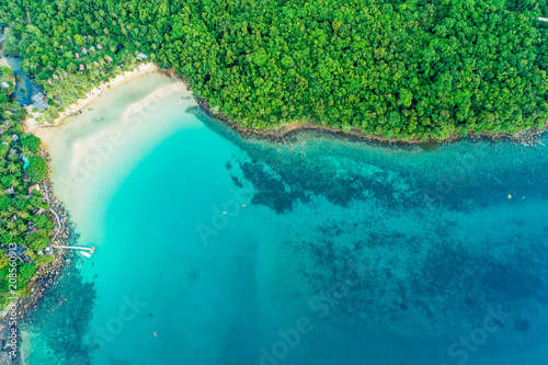 Exotic idyllic sea island with green tree forest