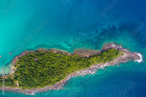 Rocky island sea beach with green tree aerial view © themorningglory