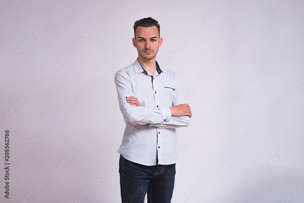 portrait of a cute young brunette man on a white background with different emotions portrait of a cute young brunette man on a white background with different emotions