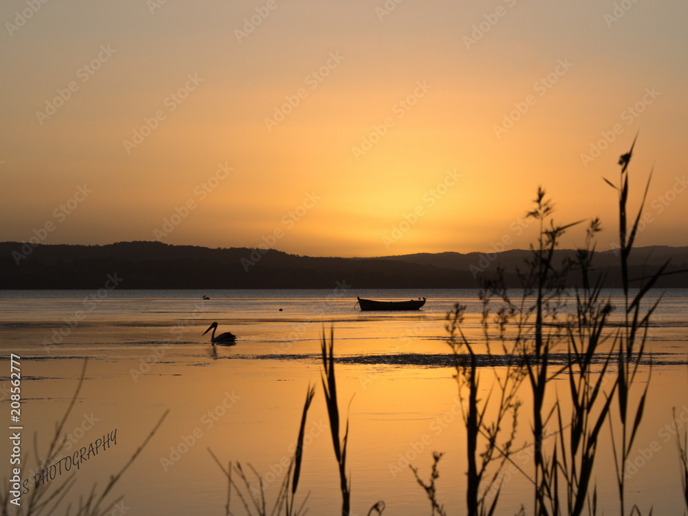 Sunset by the water