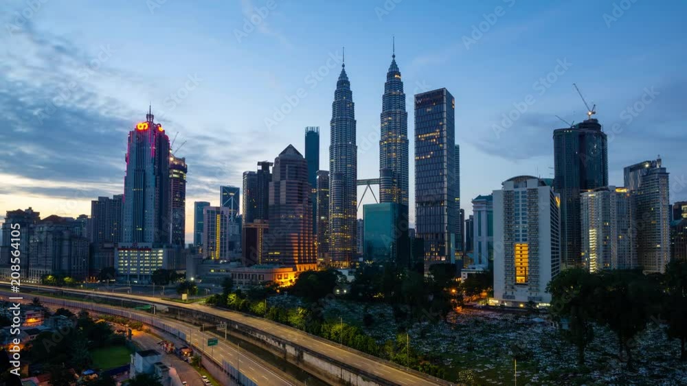 4K Time lapse of cloudy sunrise over downtown Kuala Lumpur, Malaysia. 4K Time lapse of cloudy sunrise over downtown Kuala Lumpur, Malaysia.