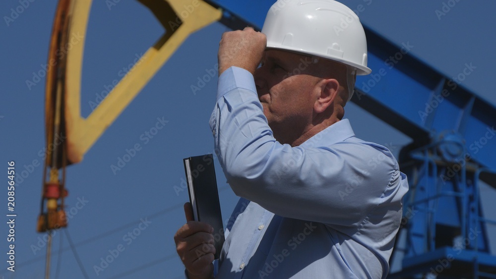 Confident Petroleum Engineer Working in Extracting Oil Industry Checking Install