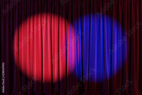 Red curtain or drapes in theater with colored lighting