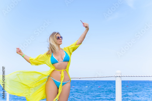 Summer holidays, vacation, travel and people concept - smiling young woman at travels having fun. Summer holiday idyllic. 