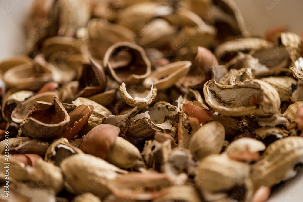 variety, mixture of different nuts on white background in white bowls variety, mixture of different nuts on white background in white bowls