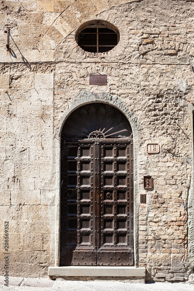 Beautiful old wooden door in San Gimignano