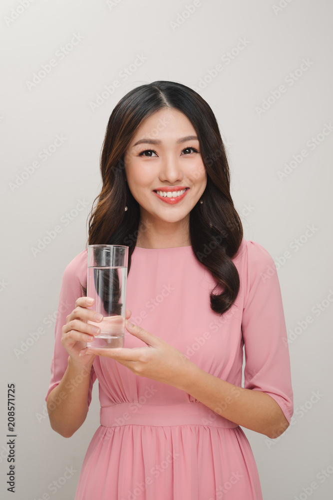 Young woman portrait with water glass. White background isolated. Young woman portrait with water glass. White background isolated.