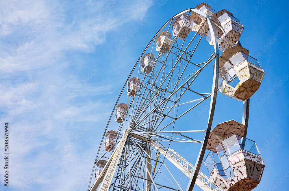 Picture of a Ferris wheel against the blue sky.