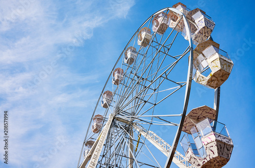 Picture of a Ferris wheel against the blue sky.