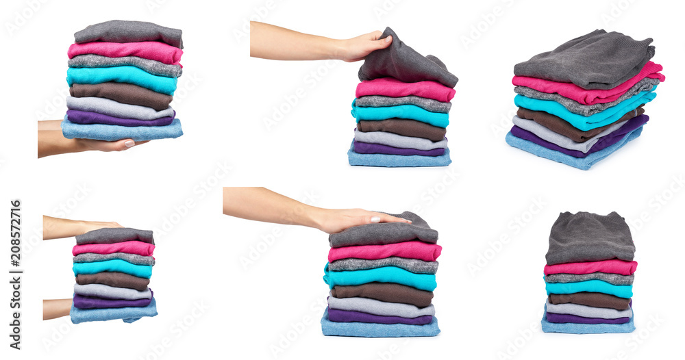 set of different pile of foldet cloth with hand, isolated on white background