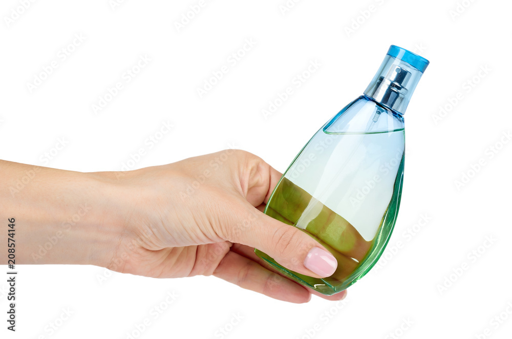 Transparent perfume bottle with hand isolated on white background Transparent perfume bottle with hand isolated on white background